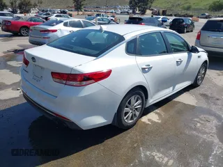2016 Kia Optima LX with VIN 5XXGT4L3XGG054286, listed as a IAAI auction lot 41924937 with 146,555 mi miles. Bid and sale history available at carsss.com. Image 4.