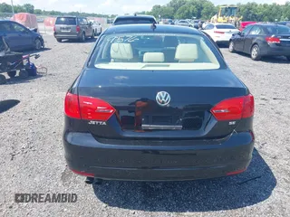 2014 Volkswagen Jetta SE with VIN 3VWD17AJ4EM429576, listed as a IAAI auction lot 42542604 with 142,313 mi miles and . Bid and sale history available at DreamBid. Image 16.