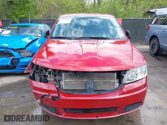 2013 Dodge Journey SE z VIN 3C4PDCAB4DT684886, wystawiony jako IAAI lot #42096367 z przebiegiem 177 338 mil mil oraz . Historia ofert i sprzedaży dostępna na DreamBid. Obrazek 13.