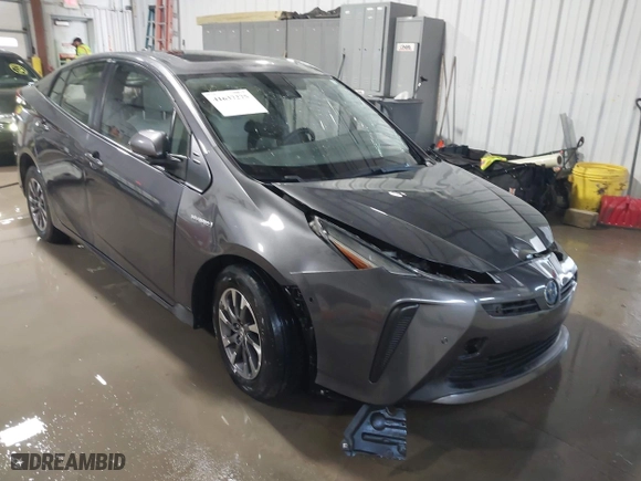 2021 Toyota Prius L Eco with VIN JTDKAMFU9M3132587, listed as a IAAI auction lot 41637275 with 84,203 mi miles. Bid and sale history available at carsss.com. Image 1.