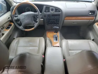 2001 Infiniti QX4 Luxury z VIN JNRDR07X81W103465, wystawiony jako Copart lot #73761114 z przebiegiem 160 676 mil mil oraz Szkody całkowita. Historia ofert i sprzedaży dostępna na DreamBid. Obrazek 8.