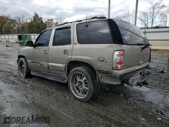 2001 GMC Yukon SLT z VIN 1GKEC13T51J145673, wystawiony jako Copart lot #83568954 z przebiegiem 310 415 mil mil oraz Szkoda całkowita • Salvage title. Historia ofert i sprzedaży dostępna na DreamBid. Obrazek 2.