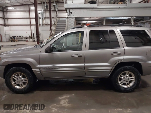 1999 Jeep Grand Cherokee Limited with VIN 1J4GW68N7XC752314, listed as a IAAI auction lot 41776905 with 228,023 mi miles. Bid and sale history available at carsss.com. Image 15.