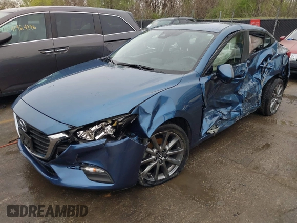 2018 Mazda 3 Touring with VIN 3MZBN1V35JM217641, listed as a IAAI auction lot 41943433 with 64,884 mi miles. Bid and sale history available at carsss.com. Image 2.