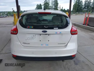 2018 Ford Focus Titanium z VIN 1FADP3N27JL314856, wystawiony jako IAAI lot #42553390 z przebiegiem 82 936 mil mil oraz . Historia ofert i sprzedaży dostępna na DreamBid. Obrazek 16.