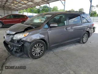 2015 Toyota Sienna XLE with VIN 5TDYK3DC0FS630013, listed as a Copart auction lot 60044955 with 124,063 mi miles and Salvage title. Bid and sale history available at DreamBid. Image 1.