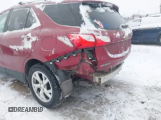 2021 Chevrolet Equinox Premier z VIN 2GNAXXEV4M6105996, wystawiony jako IAAI lot #41402065 z przebiegiem 51 083 mil mil oraz . Historia ofert i sprzedaży dostępna na DreamBid. Obrazek 6.