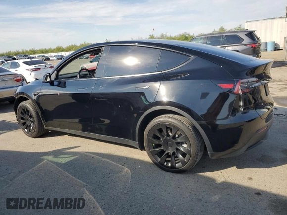 2023 Tesla Model Y Long Range with VIN 7SAYGDEE5PF834645, listed as a Copart auction lot 48596925 with 26,896 mi miles and Salvage Title. Bid and sale history available at DreamBid. Image 2.