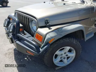 2003 Jeep Wrangler X with VIN 1J4FA39S03P312550, listed as a IAAI auction lot 41837150 with 127,239 mi miles and . Bid and sale history available at DreamBid. Image 6.