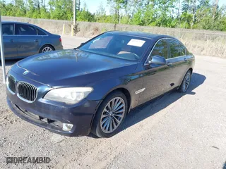 2011 BMW 7 Series 740i with VIN WBAKA4C52BC392112, listed as a IAAI auction lot 41736939 with 125,953 mi miles. Bid and sale history available at carsss.com. Image 2.