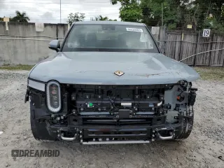 2022 Rivian R1T Launch Edition z VIN 7FCTGAALXNN004228, wystawiony jako Copart lot #43226985 z przebiegiem 4 mil mil oraz Szkody całkowita. Historia ofert i sprzedaży dostępna na DreamBid. Obrazek 5.