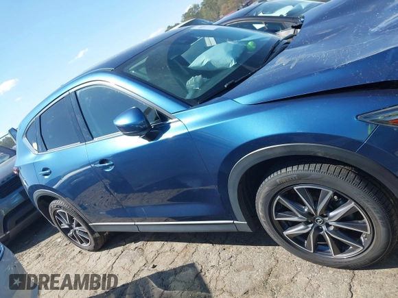 2017 Mazda CX-5 Grand Touring with VIN JM3KFADL8H0105518, listed as a IAAI auction lot 41876779 with 82,540 mi miles. Bid and sale history available at carsss.com. Image 13.