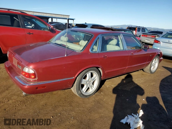 1999 Jaguar XJ with VIN SAJPX1849XC857869, listed as a Copart auction lot 83773914 with 172,496 mi miles and Clean title. Bid and sale history available at DreamBid. Image 3.