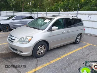 2005 Honda Odyssey EX-L with VIN 5FNRL38715B003399, listed as a IAAI auction lot 42589092 with 252,737 mi miles and . Bid and sale history available at DreamBid. Image 2.