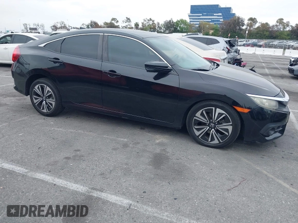 2016 Honda Civic Sedan EX-T with VIN 2HGFC1F34GH645220, listed as a IAAI auction lot 42043630 with 55,301 mi miles. Bid and sale history available at carsss.com. Image 13.