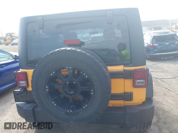 2012 Jeep Wrangler Sport with VIN 1C4AJWAG0CL128595, listed as a IAAI auction lot 42048590 with 133,085 mi miles and . Bid and sale history available at DreamBid. Image 16.