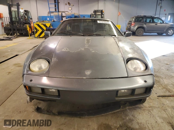 1984 Porsche 928 z VIN WP0JB0925ES861303, wystawiony jako Copart lot #41979575 z przebiegiem 114 593 mil mil oraz Nie do naprawy • Non repairable. Historia ofert i sprzedaży dostępna na DreamBid. Obrazek 5.