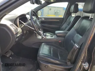 2014 Jeep Grand Cherokee Limited with VIN 1C4RJFBG4EC265947, listed as a Copart auction lot 52448155 with 127,700 mi miles and Salvage title. Bid and sale history available at DreamBid. Image 7.