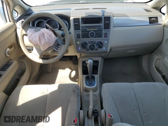 2010 Nissan Versa 1.8 SL with VIN 3N1BC1CP1AL435695, listed as a Copart auction lot 52099085 with 184,891 mi miles and Salvage Title. Bid and sale history available at carsss.com. Image 8.