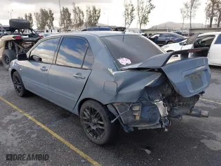2004 Mitsubishi Lancer ES with VIN JA3AJ26E54U054570, listed as a IAAI auction lot 41592397 with 220,140 mi miles. Bid and sale history available at carsss.com. Image 3.