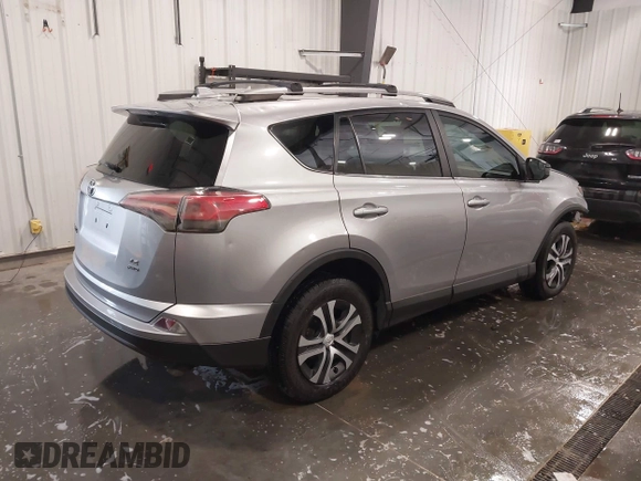 2017 Toyota RAV4 LE with VIN 2T3BFREV3HW596227, listed as a IAAI auction lot 41814317 with 204,991 mi miles. Bid and sale history available at carsss.com. Image 4.