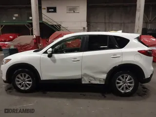 2016 Mazda CX-5 Touring with VIN JM3KE4CY0G0853261, listed as a IAAI auction lot 41861176 with 63,491 mi miles. Bid and sale history available at carsss.com. Image 14.