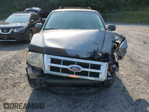 2008 Ford Escape XLS with VIN 1FMCU02Z18KE11979, listed as a Copart auction lot 60212165 with 239,177 mi miles and Salvage title. Bid and sale history available at DreamBid. Image 5.