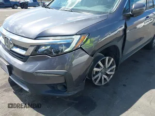 2021 Honda Pilot EX-L with VIN 5FNYF5H57MB046740, listed as a IAAI auction lot 41943366 with 31,198 mi miles and . Bid and sale history available at DreamBid. Image 12.
