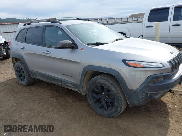 2015 Jeep Cherokee Trailhawk with VIN 1C4PJMBS0FW522182, listed as a IAAI auction lot 42544508 with 74,910 mi miles and . Bid and sale history available at DreamBid. Image 1.