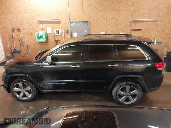 2015 Jeep Grand Cherokee Limited with VIN 1C4RJFBG8FC910133, listed as a IAAI auction lot 41289929 with 141,226 mi miles. Bid and sale history available at carsss.com. Image 14.