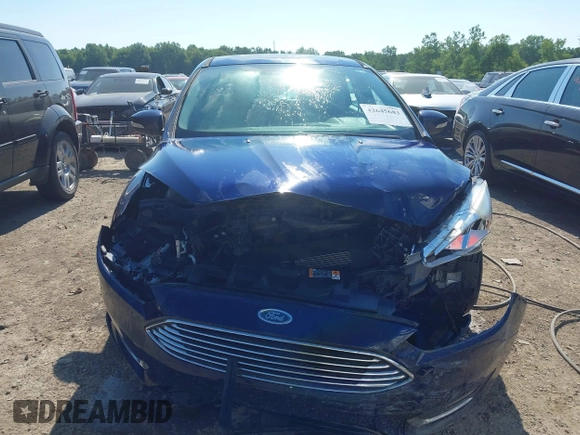 2016 Ford Focus Titanium with VIN 1FADP3N23GL231613, listed as a IAAI auction lot 42645683 with 76,072 mi miles and . Bid and sale history available at DreamBid. Image 13.