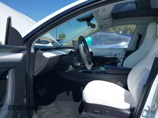2023 Tesla Model Y Long Range with VIN 7SAYGDEE2PF632121, listed as a IAAI auction lot 41798780 with 53,773 mi miles. Bid and sale history available at carsss.com. Image 5.