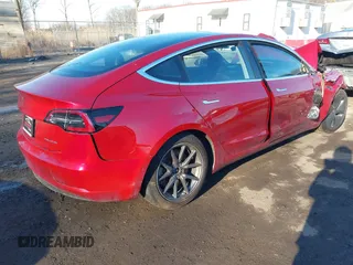 2018 Tesla Model 3 Long Range Battery with VIN 5YJ3E1EB4JF065581, listed as a IAAI auction lot 41542190 with 4,154 mi miles and . Bid and sale history available at DreamBid. Image 4.