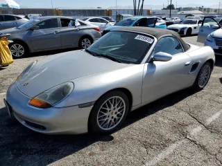 2000 Porsche Boxster z VIN WP0CA2982YU626135, wystawiony jako Copart lot #59193915 z przebiegiem 114 984 mil mil oraz Czysty tytuł • Clean title. Historia ofert i sprzedaży dostępna na DreamBid. Obrazek 1.