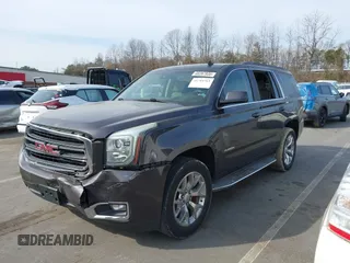 2015 GMC Yukon SLE with VIN 1GKS1AKCXFR269862, listed as a IAAI auction lot 41784763 with 156,286 mi miles. Bid and sale history available at carsss.com. Image 2.