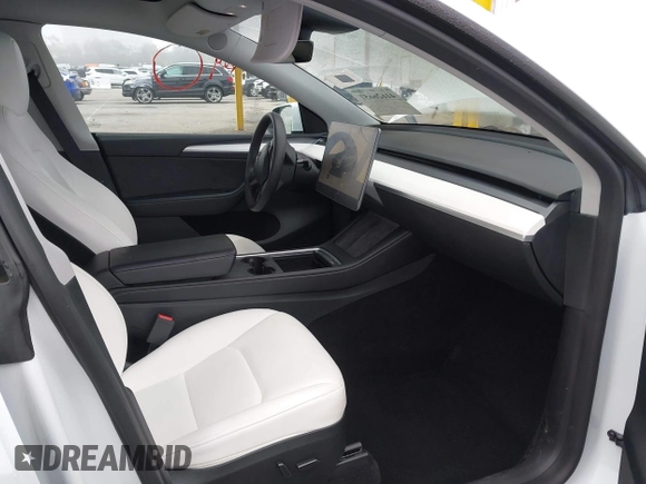 2023 Tesla Model Y Long Range with VIN 7SAYGAEE7PF766735, listed as a IAAI auction lot 41626651 with 21,983 mi miles. Bid and sale history available at carsss.com. Image 5.