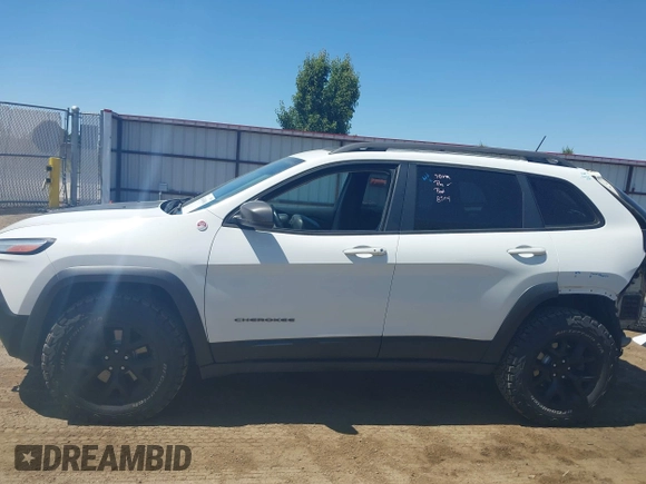 2014 Jeep Cherokee Trailhawk with VIN 1C4PJMBSXEW236807, listed as a IAAI auction lot 42660980 with 157,225 mi miles and . Bid and sale history available at DreamBid. Image 15.
