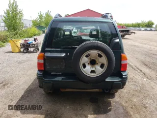 2003 Suzuki Vitara JLX z VIN 2S3TD52V136101732, wystawiony jako Copart lot #58477845 z przebiegiem 105 628 mil mil oraz Czysty tytuł • Clean title. Historia ofert i sprzedaży dostępna na DreamBid. Obrazek 6.