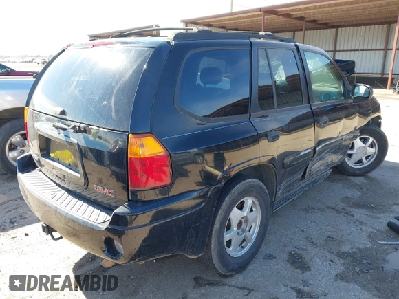 2003 GMC Envoy SLE with VIN 1GKDS13S732134354, listed as a IAAI auction lot 41305506 with 221,733 mi miles. Bid and sale history available at carsss.com. Image 4.