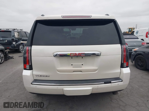 2015 GMC Yukon Denali with VIN 1GKS2CKJ9FR294551, listed as a IAAI auction lot 42162654 with 106,063 mi miles. Bid and sale history available at carsss.com. Image 17.