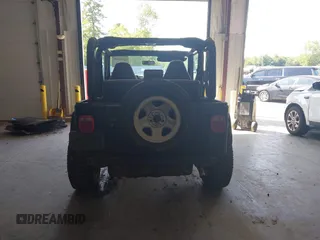 1999 Jeep Wrangler Sport with VIN 1J4FY19S4XP494405, listed as a IAAI auction lot 42542416 with 168,856 mi miles and . Bid and sale history available at DreamBid. Image 16.
