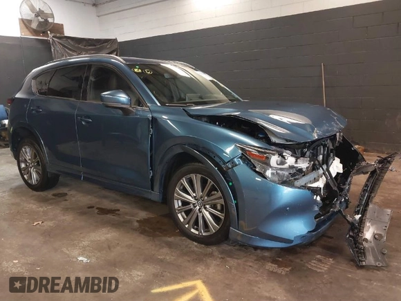 2023 Mazda CX-5 Signature with VIN JM3KFBXY4P0120187, listed as a IAAI auction lot 41706264 with 9,402 mi miles and . Bid and sale history available at carsss.com. Image 1.