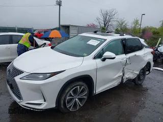 2021 Lexus RX with VIN 2T2HZMDA3MC266624, listed as a IAAI auction lot 42011029 with 27,401 mi miles. Bid and sale history available at carsss.com. Image 2.