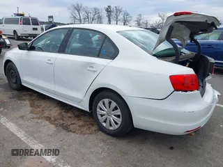2014 Volkswagen Jetta Sedan S with VIN 3VW2K7AJ5EM329328, listed as a IAAI auction lot 41995084 with 72,409 mi miles. Bid and sale history available at carsss.com. Image 3.