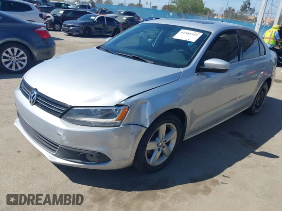 2012 Volkswagen Jetta TDI w/Premium with VIN 3VWLL7AJ8CM314305, listed as a IAAI auction lot 41885355 with 75,669 mi miles and . Bid and sale history available at DreamBid. Image 2.