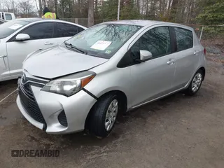 2015 Toyota Yaris L with VIN VNKKTUD33FA028588, listed as a IAAI auction lot 41575230 with 148,071 mi miles. Bid and sale history available at carsss.com. Image 2.