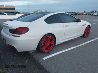 2013 BMW 6 Series 650i with VIN WBAYM9C57DDW20312, listed as a IAAI auction lot 41861212 with 98,662 mi miles and . Bid and sale history available at carsss.com. Image 4.