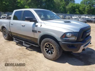 2016 Ram 1500 Rebel z VIN 1C6RR7YT7GS185173, wystawiony jako IAAI lot #42033684 z przebiegiem 152 758 mil mil oraz . Historia ofert i sprzedaży dostępna na DreamBid. Obrazek 1.