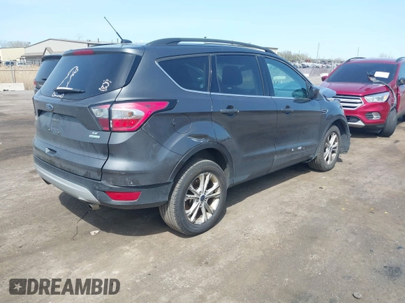 2017 Ford Escape SE z VIN 1FMCU0GD0HUE06774, wystawiony jako IAAI lot #42135955 z przebiegiem 141 807 mil mil oraz . Historia ofert i sprzedaży dostępna na DreamBid. Obrazek 4.