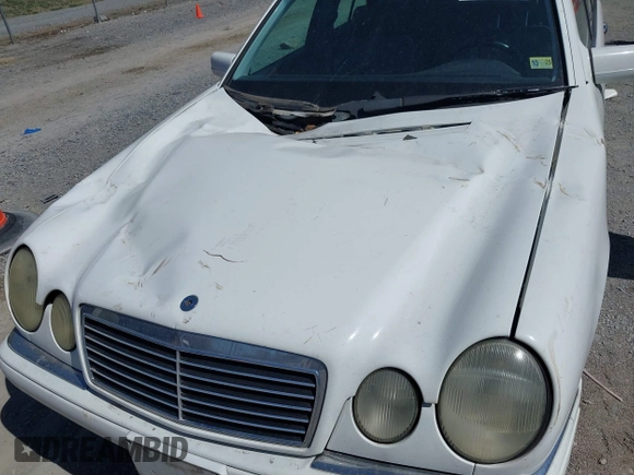1999 Mercedes-Benz E-Class with VIN WDBJF82H4XX025925, listed as a IAAI auction lot 41839398 with 238,583 mi miles. Bid and sale history available at carsss.com. Image 6.